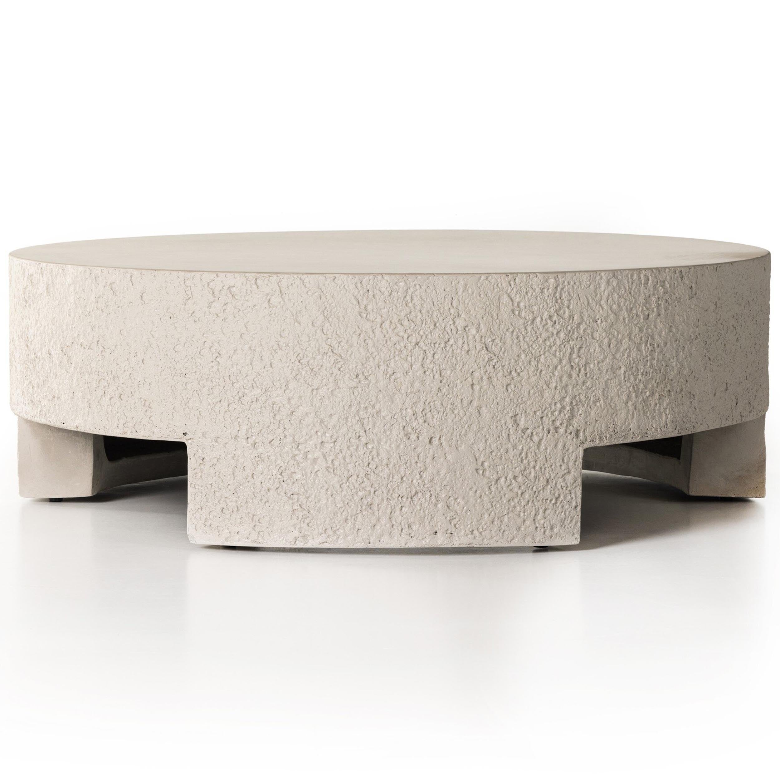 Kember Outdoor Coffee Table, Matte Stone in solid concrete with cutout legs for modern outdoor spaces.