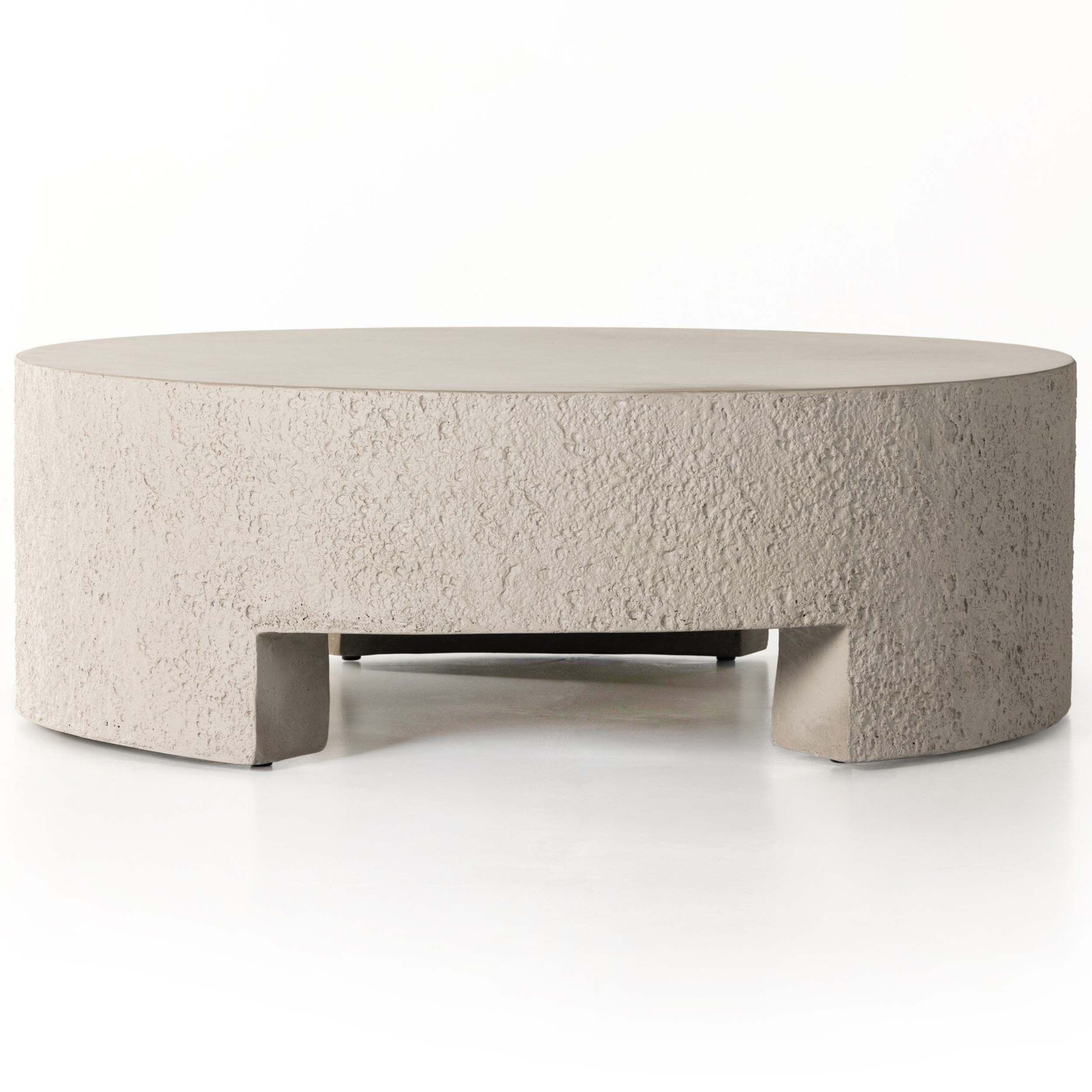 Kember Outdoor Coffee Table, Matte Stone with cutout legs and textured concrete finish for outdoor and indoor use.