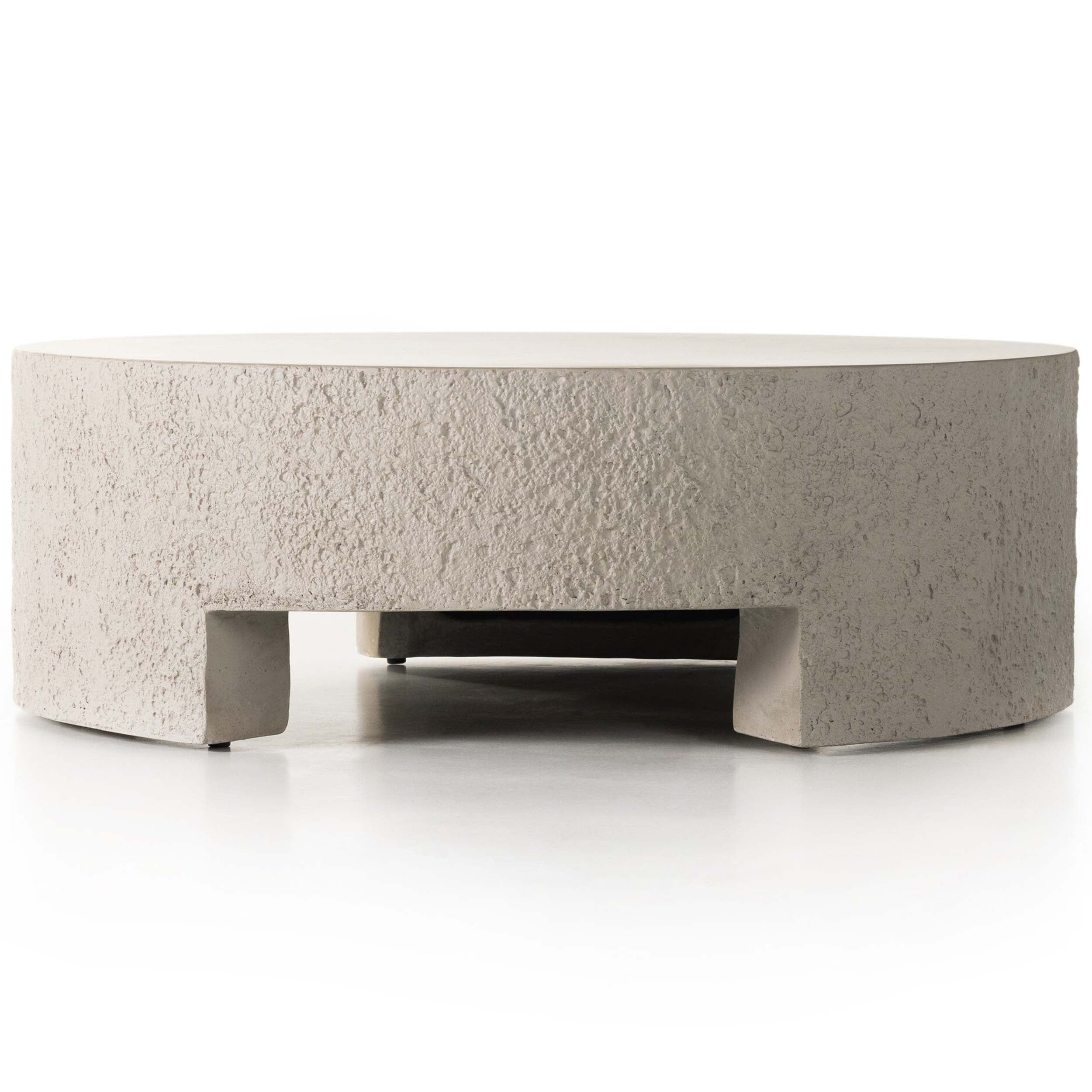 Kember Outdoor Coffee Table, Matte Stone with textured surface and cutout legs for modern outdoor settings.