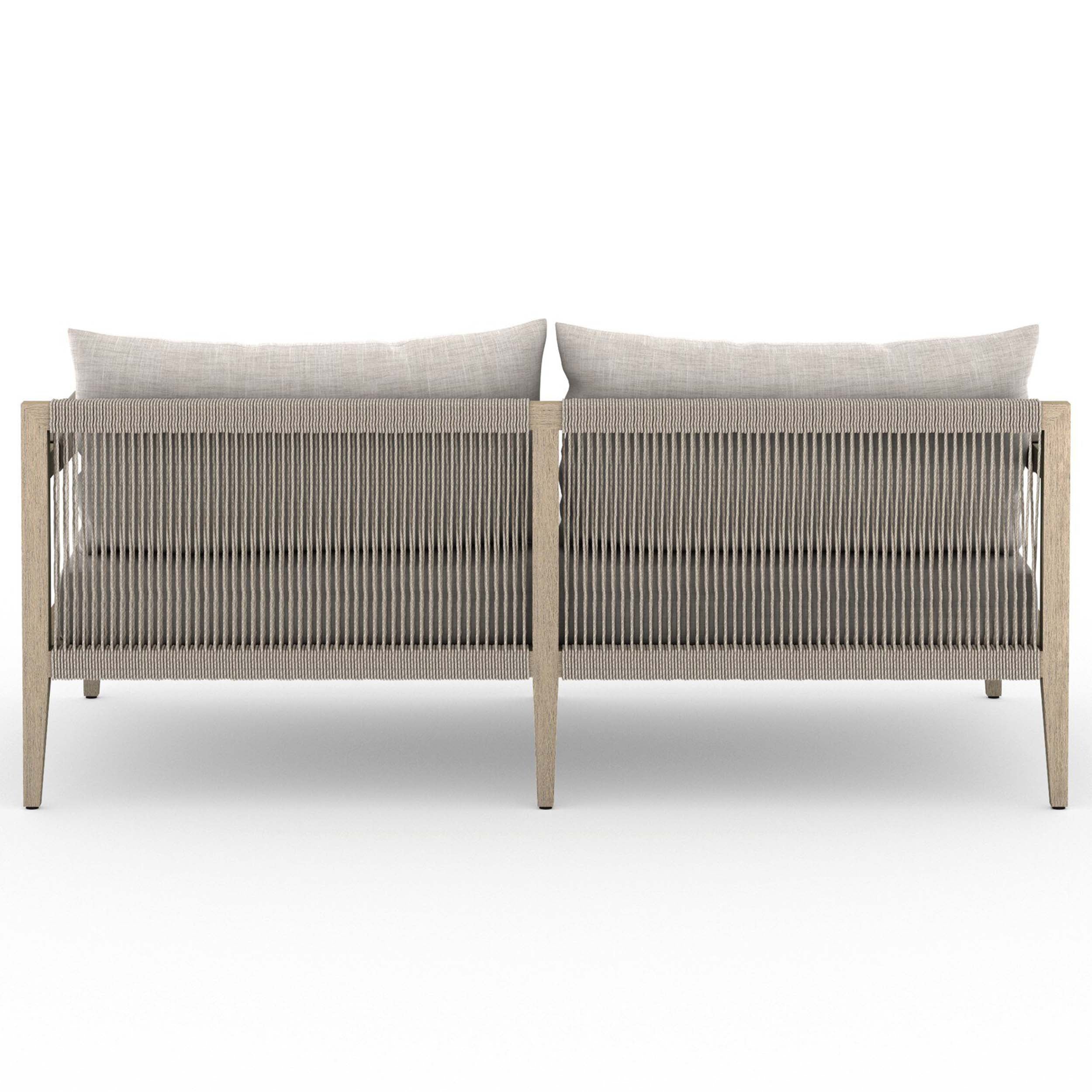 Sherwood Outdoor Sofa, Washed Brown, Venao Charcoal showcasing a modern silhouette with plush cushions and textured detailing.