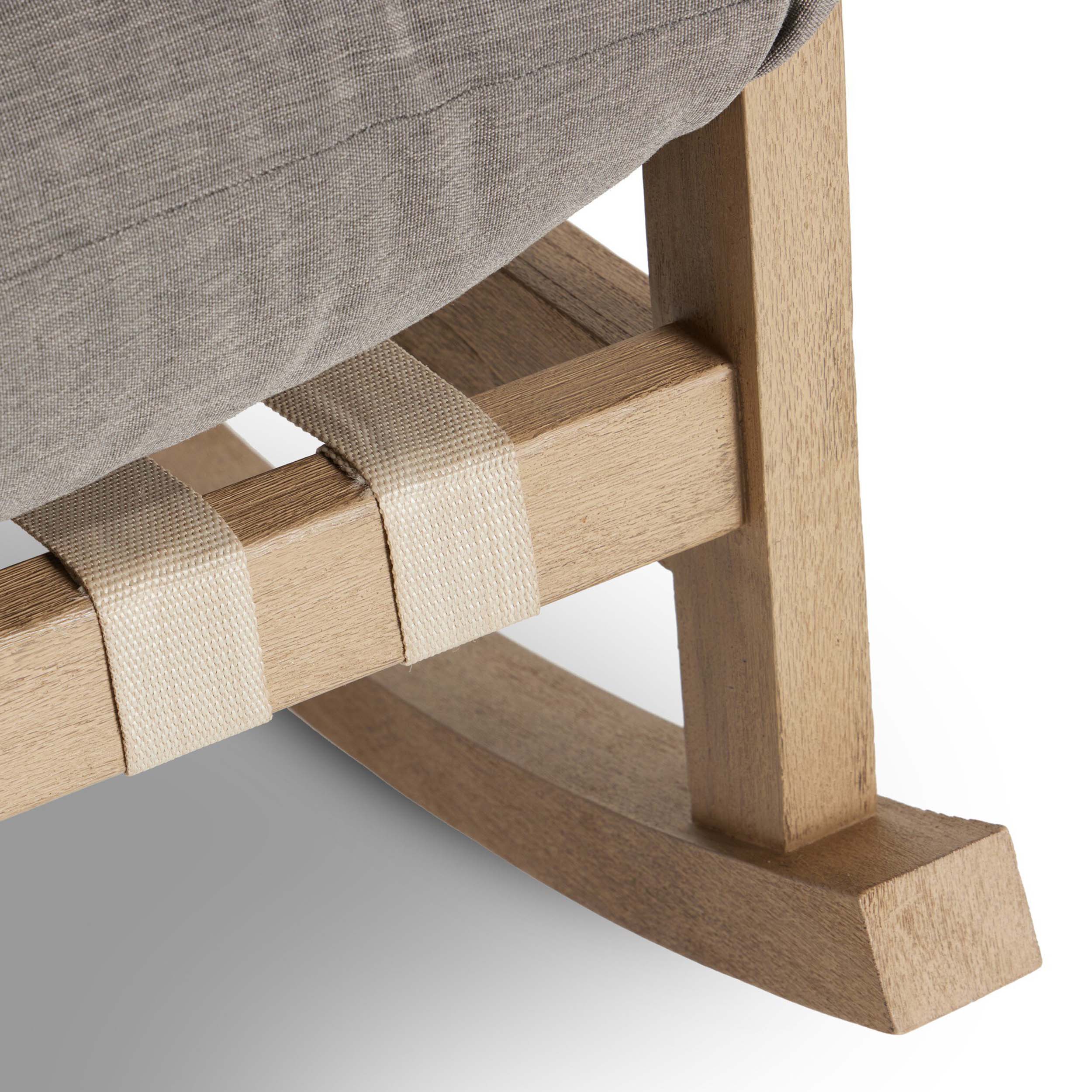 Close-up of Aiken Outdoor Rocking Chair, Venao Charcoal, showcasing woven straps and wooden frame details.