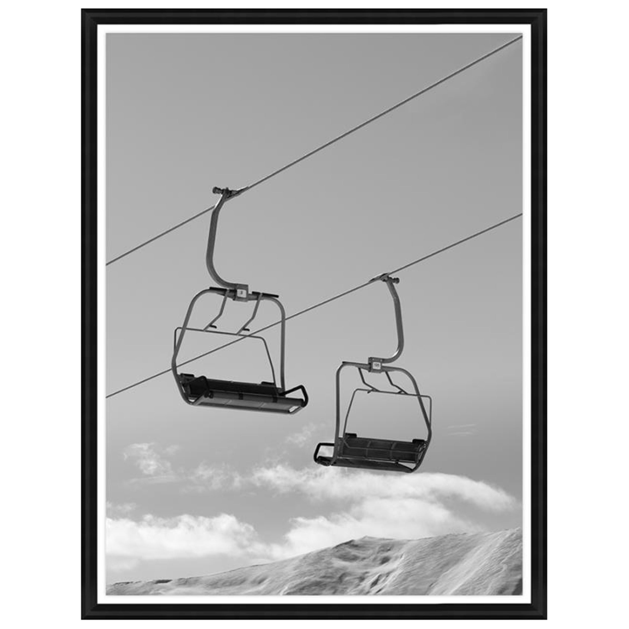 Black and White Chair Lifts and Snowy Winter High Mountains